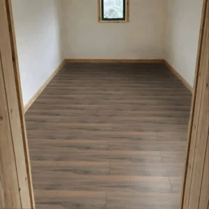 Laminate flooring with a dark walnut finish